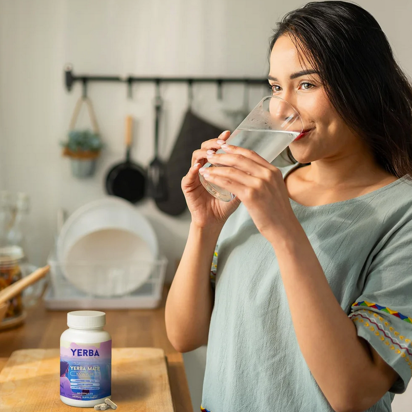 Woman taking Yerba Mate capsules with water – natural energy supplement for focus, stamina, and daily wellness boost
